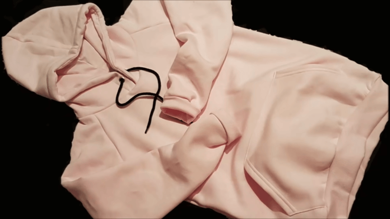 pink hand stitched sweatshirt with meticulous craftsmanship