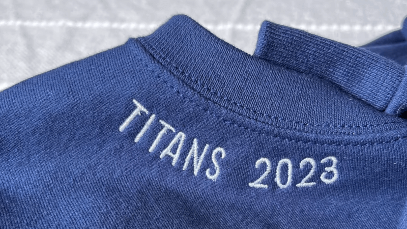 name embroidered sweatshirt in blue color with text Titans 2023