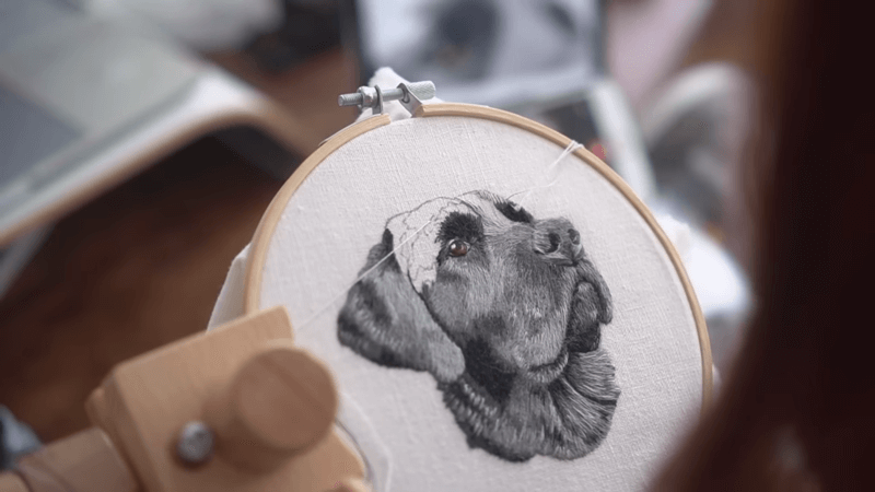 embroider a gift of a dog portrait on white fabric