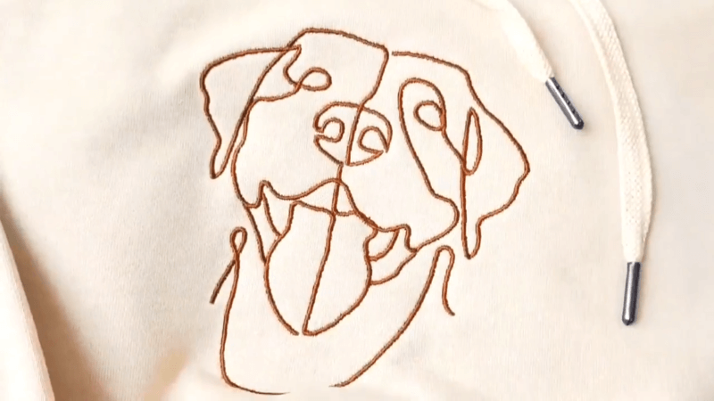 Embroidered dog portrait on white embroidered sweatshirt