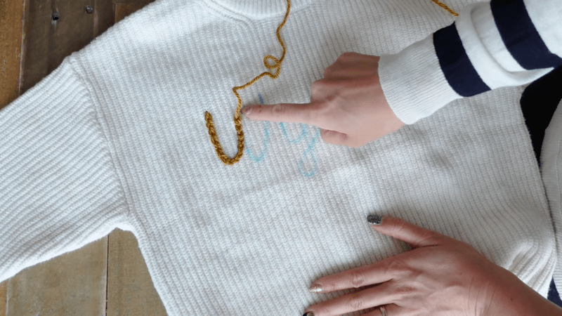 white embroidered sweatshirt