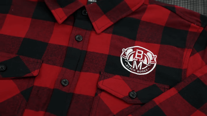 red flannel shirt with white black moose logo