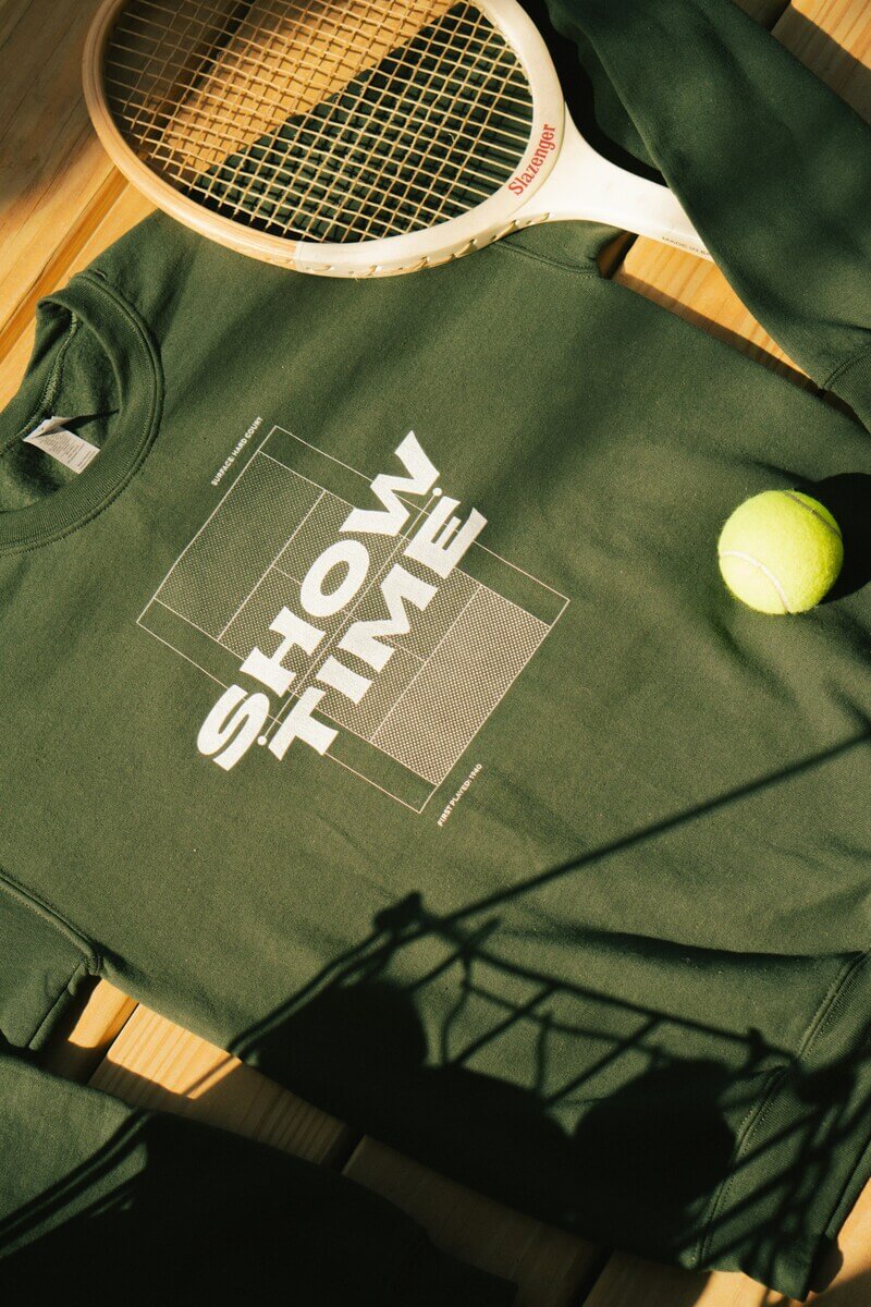 green embroidered sweatshirt tennis racket